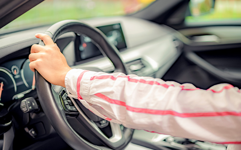 Testing steering responsiveness during a used car test drive.